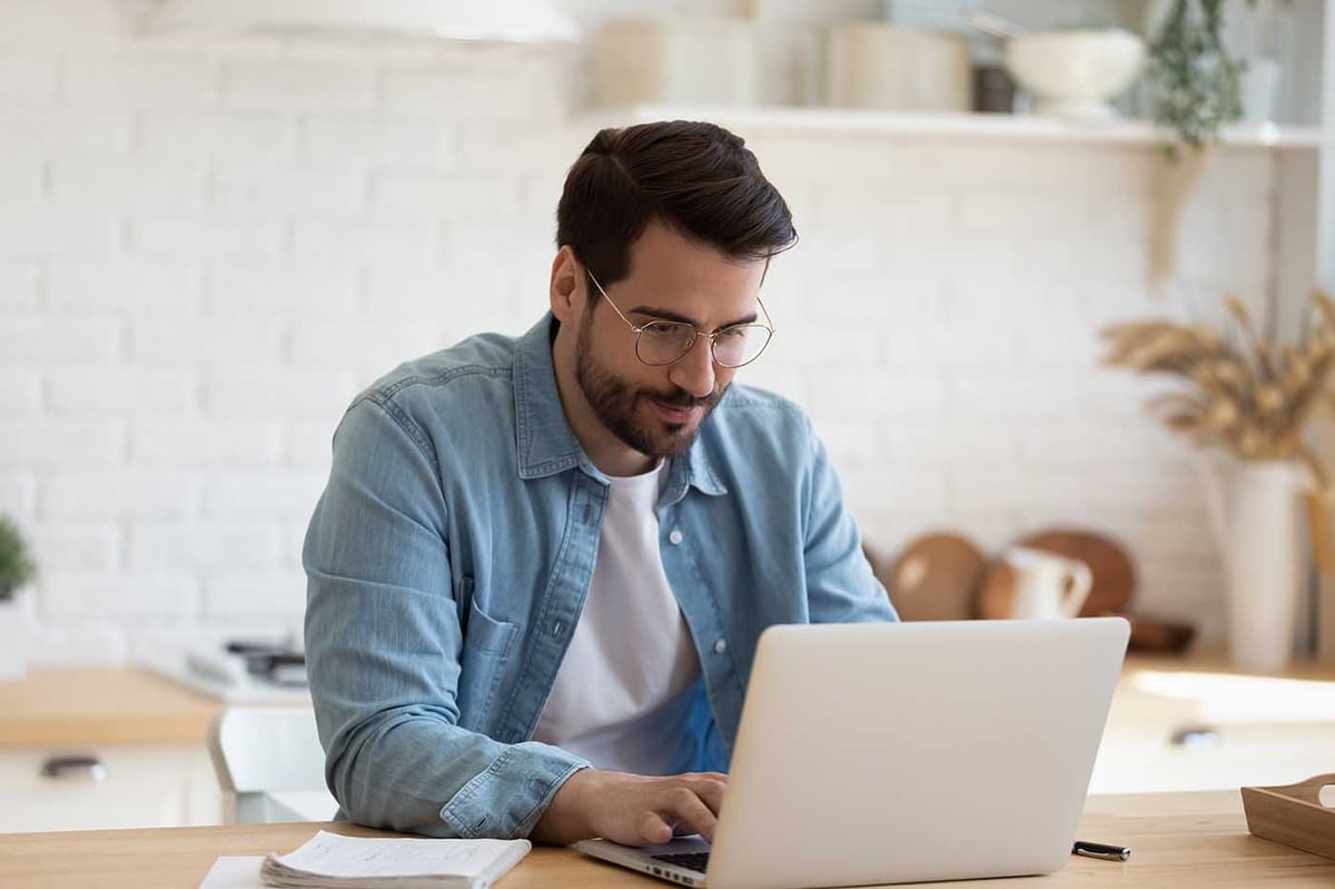 guy-with-glasses-working-from-home-1400px-1