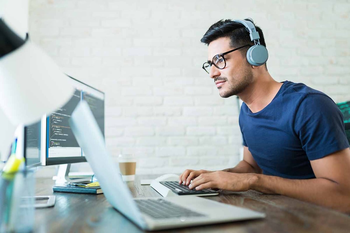 guy-with-headphones-home-office-1200px