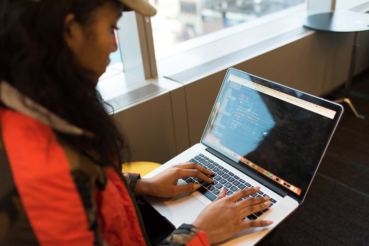 woman-coding-with-cap-1400px